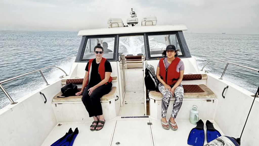 UNCG Art professor Kelley O'Brien on a boat in Bahrain